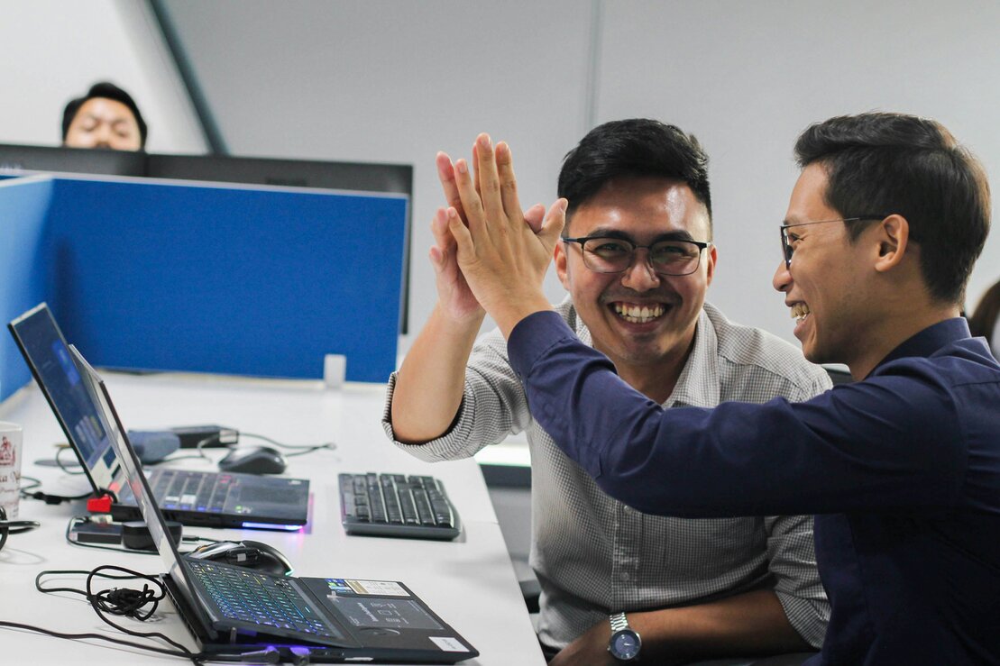Bilingual sales team assisting car buyers
