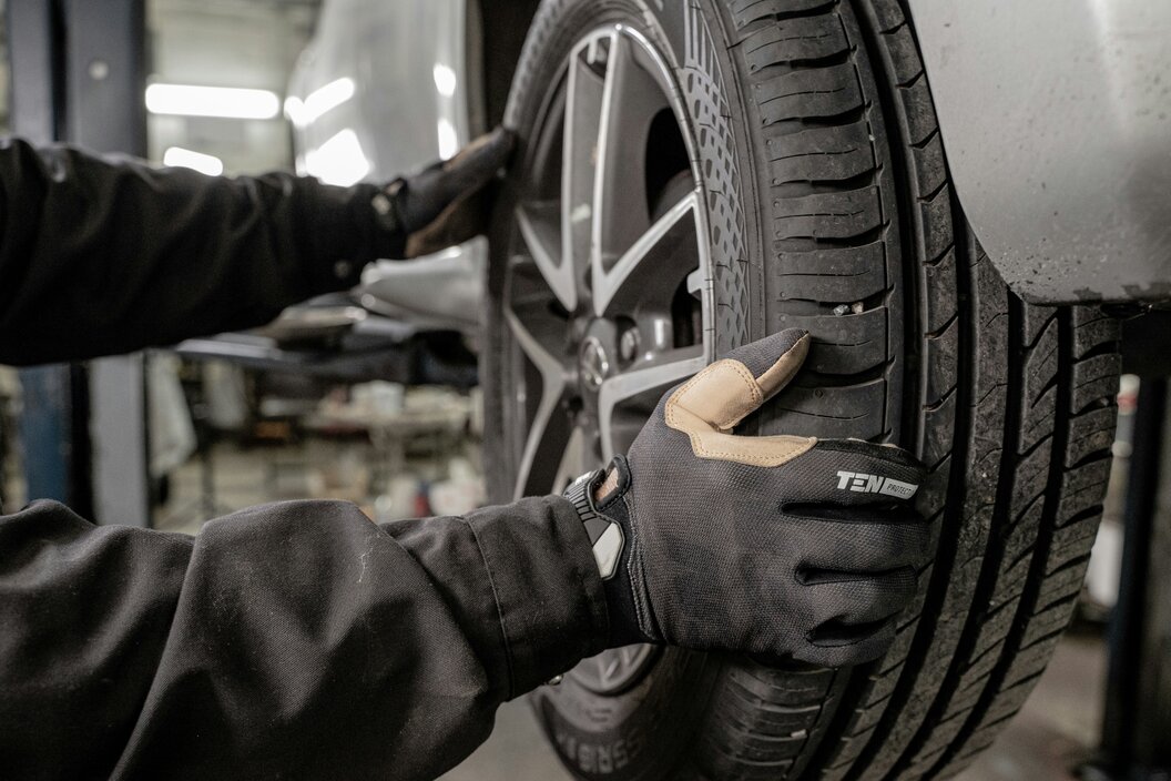 Close-up of a car brake disc being serviced